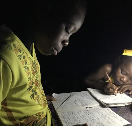A solar lamp lights up a home for children to do their homework after sun down